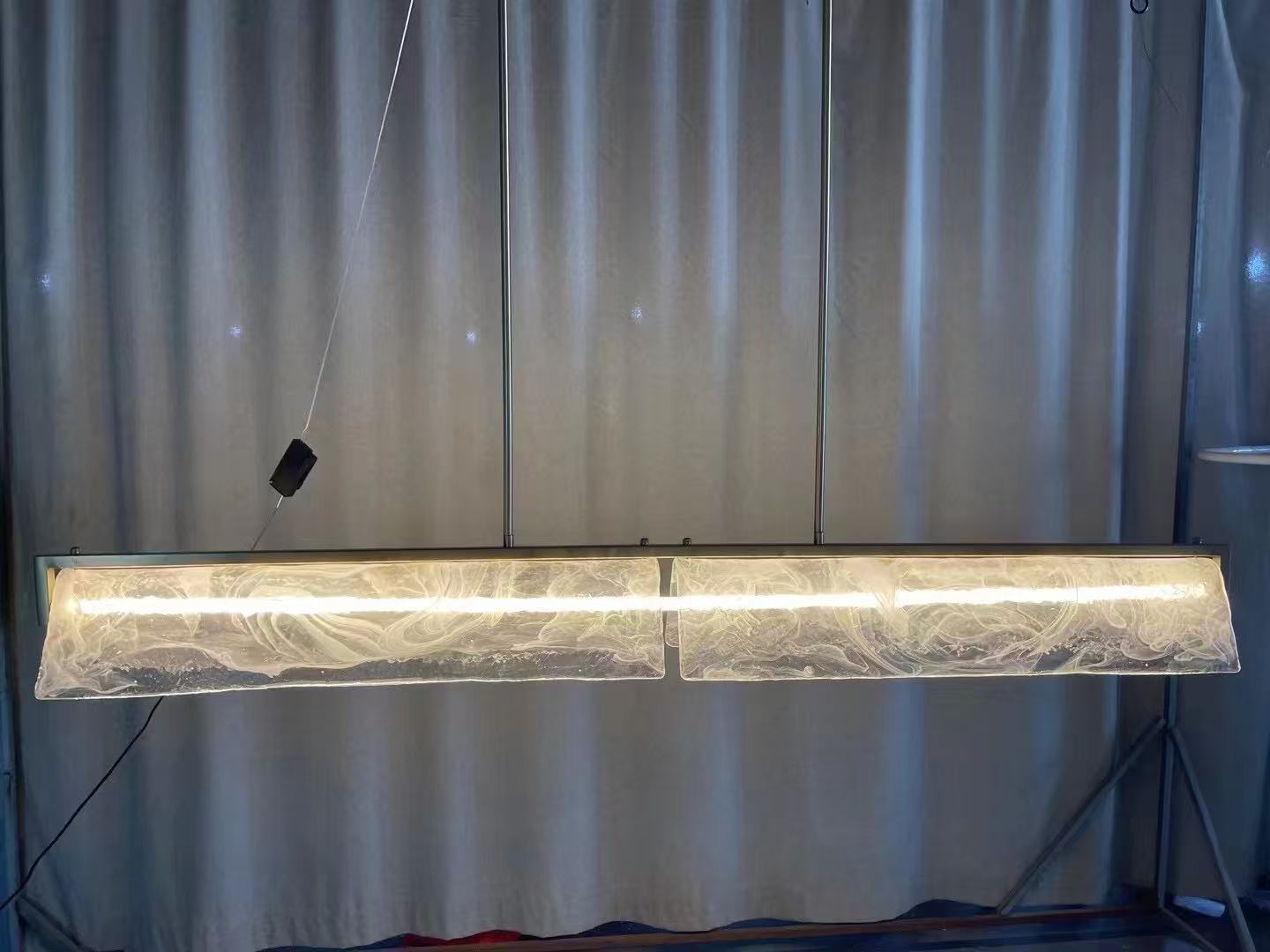 Transparent textured linear pendant during workshop testing