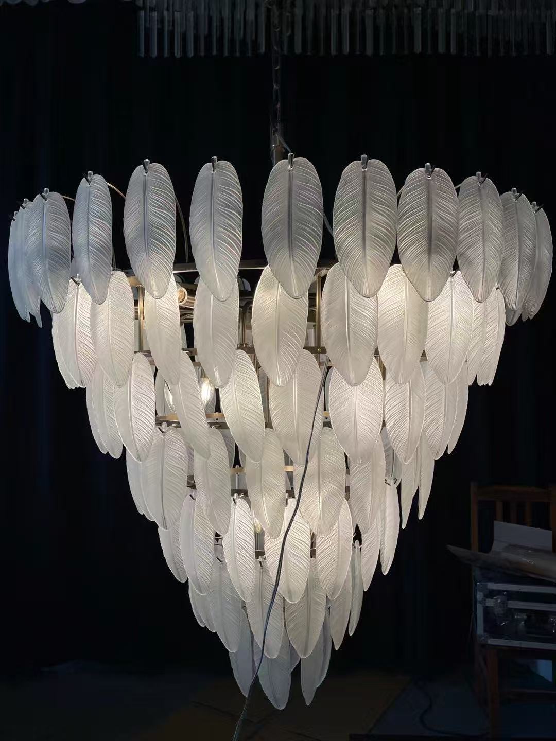 Tiered leaf-glass chandelier during workshop testing
