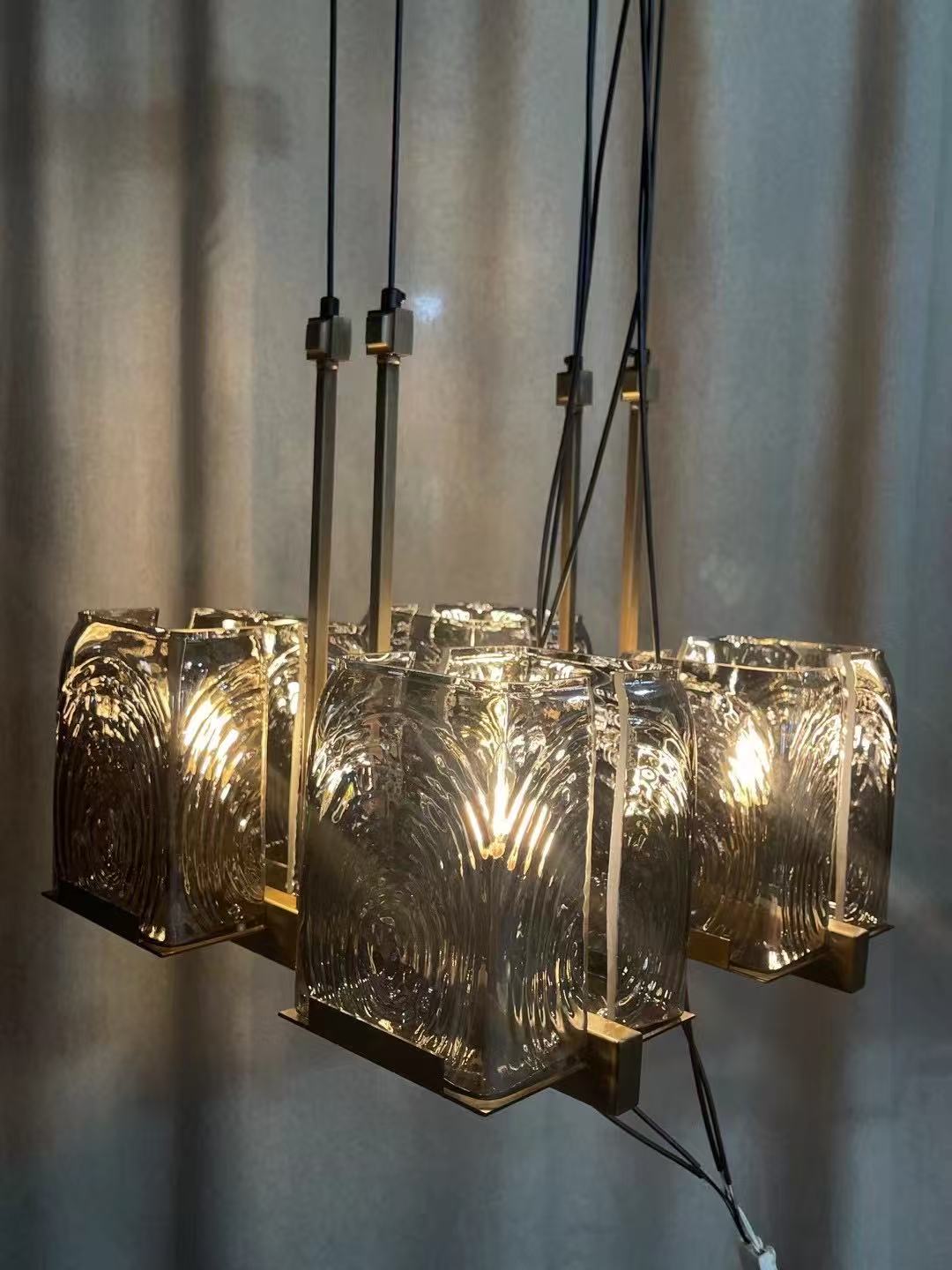 Cluster pendant with thick textured glass shades in the workshop