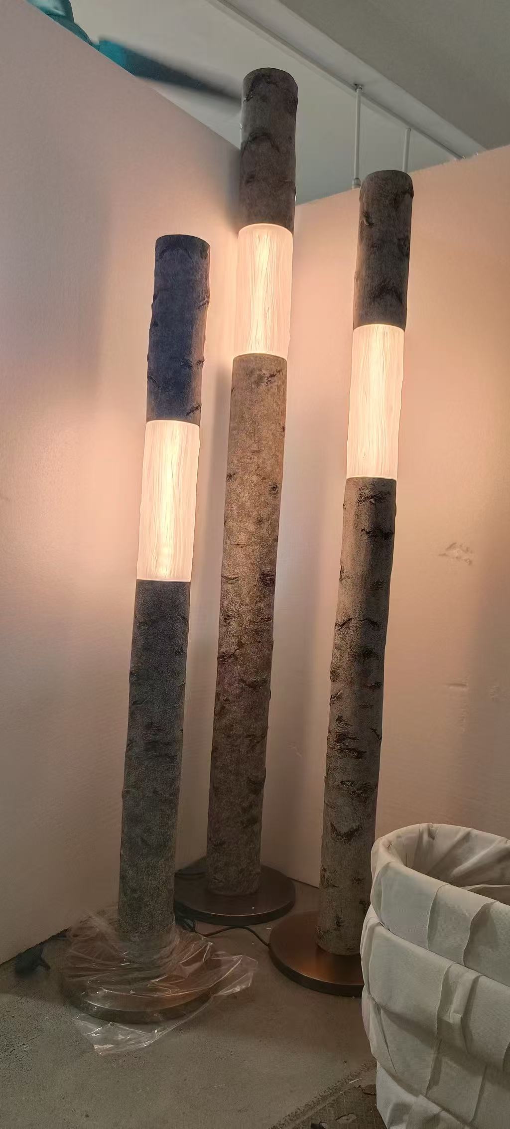 Textured column floor lamp photographed in the workshop