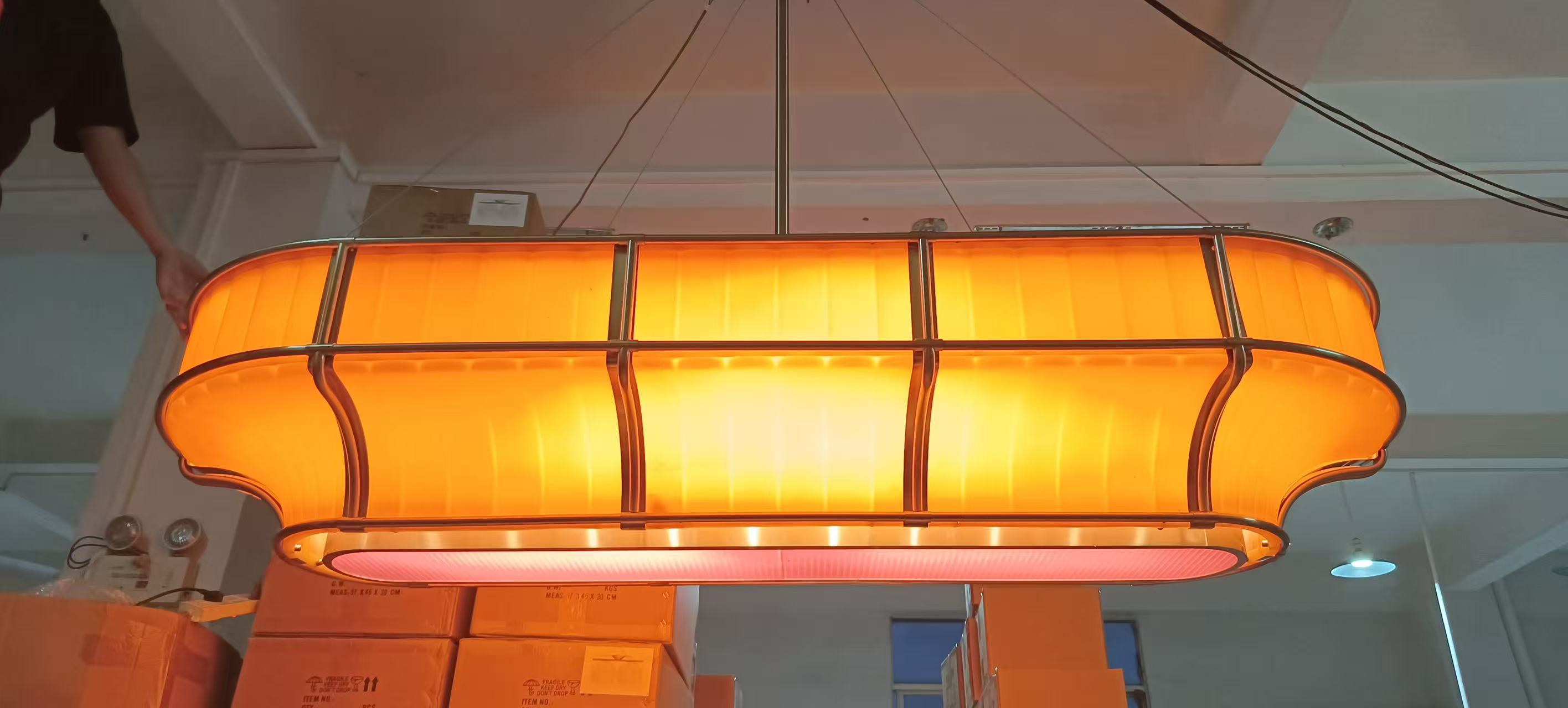 Amber linear pendant photographed in the workshop