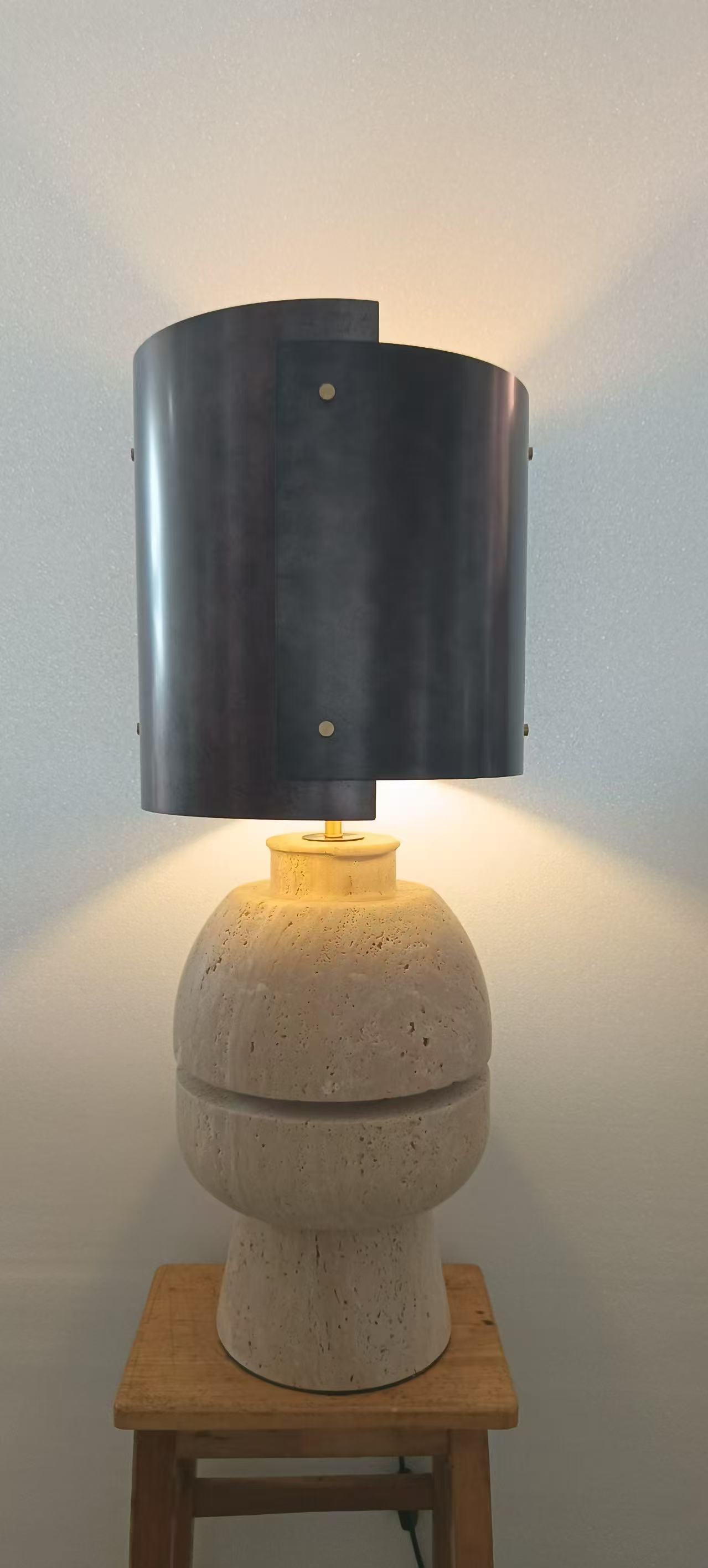 Stone-base table lamp photographed in the workshop
