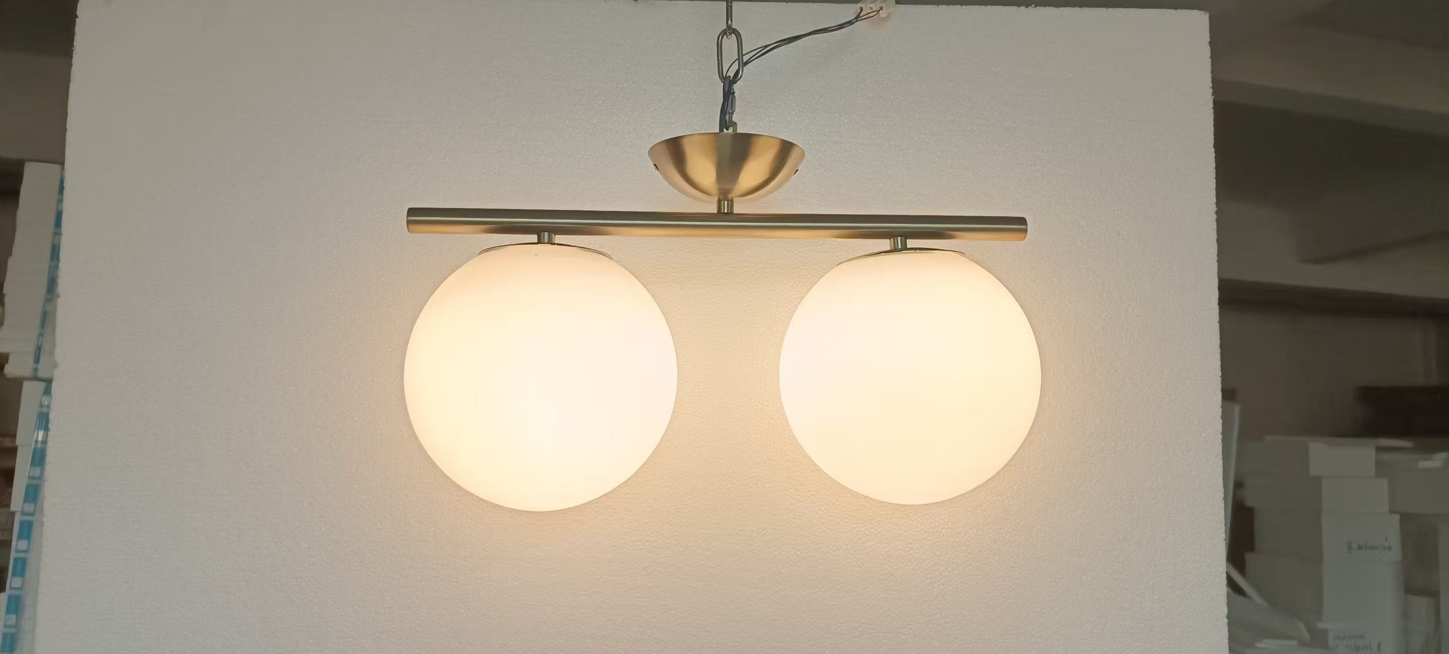 Twin-globe light photographed in the workshop