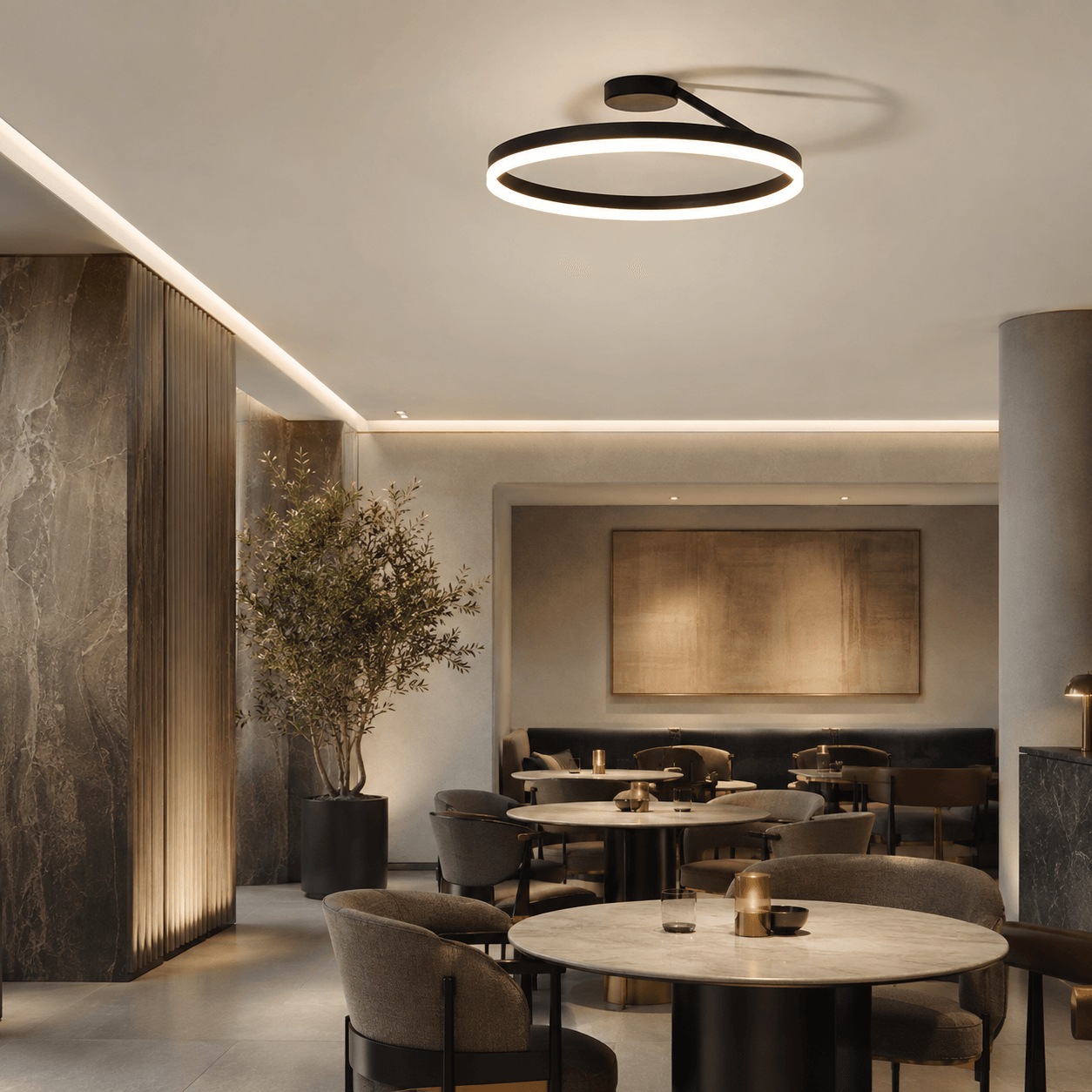 Custom black halo ring ceiling light installed in a hospitality restaurant interior.