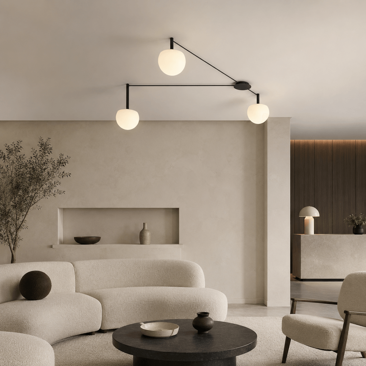 Custom three-globe ceiling light with opal glass shades and black metal arms.