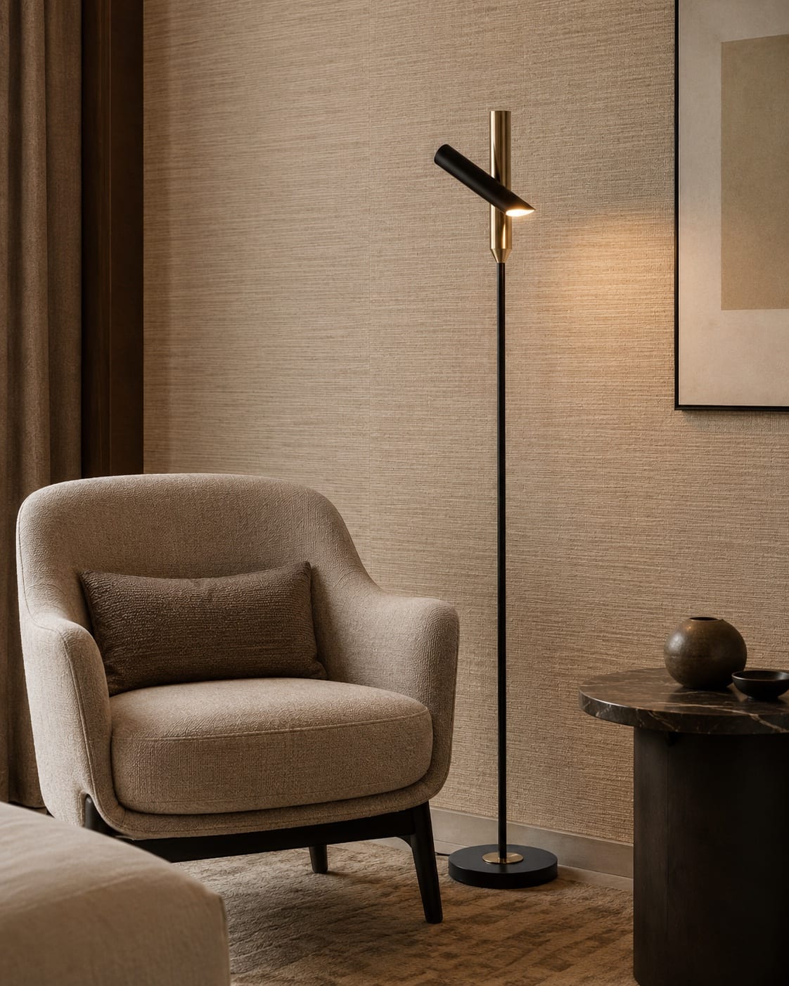 Custom directional reading floor lamp with a slim black stem, brass detail and compact adjustable head