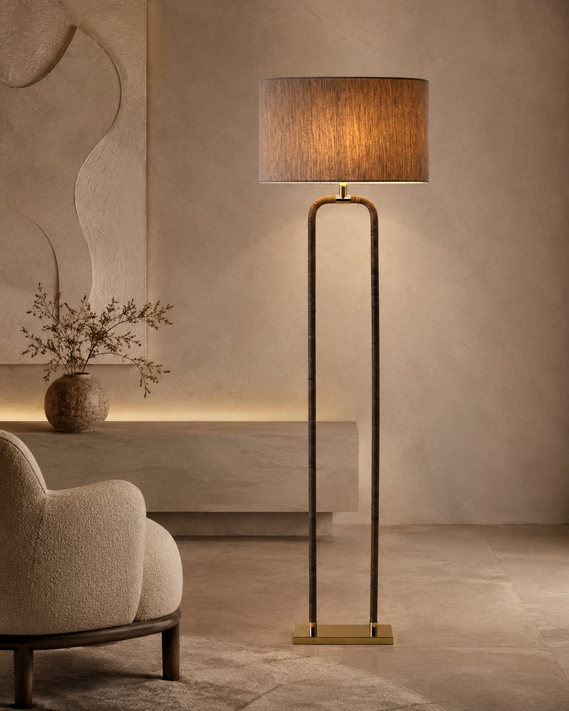Custom wrapped frame floor lamp with a tall tactile structure, brass details and dark fabric shade