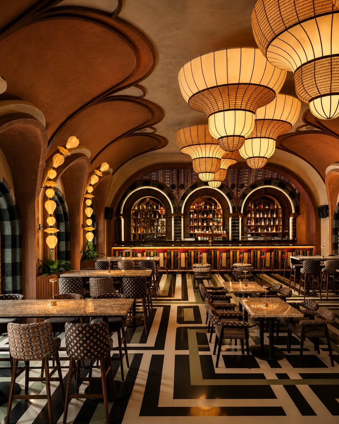 Hospitality restaurant interior with decorative pendant lighting and integrated architectural illumination