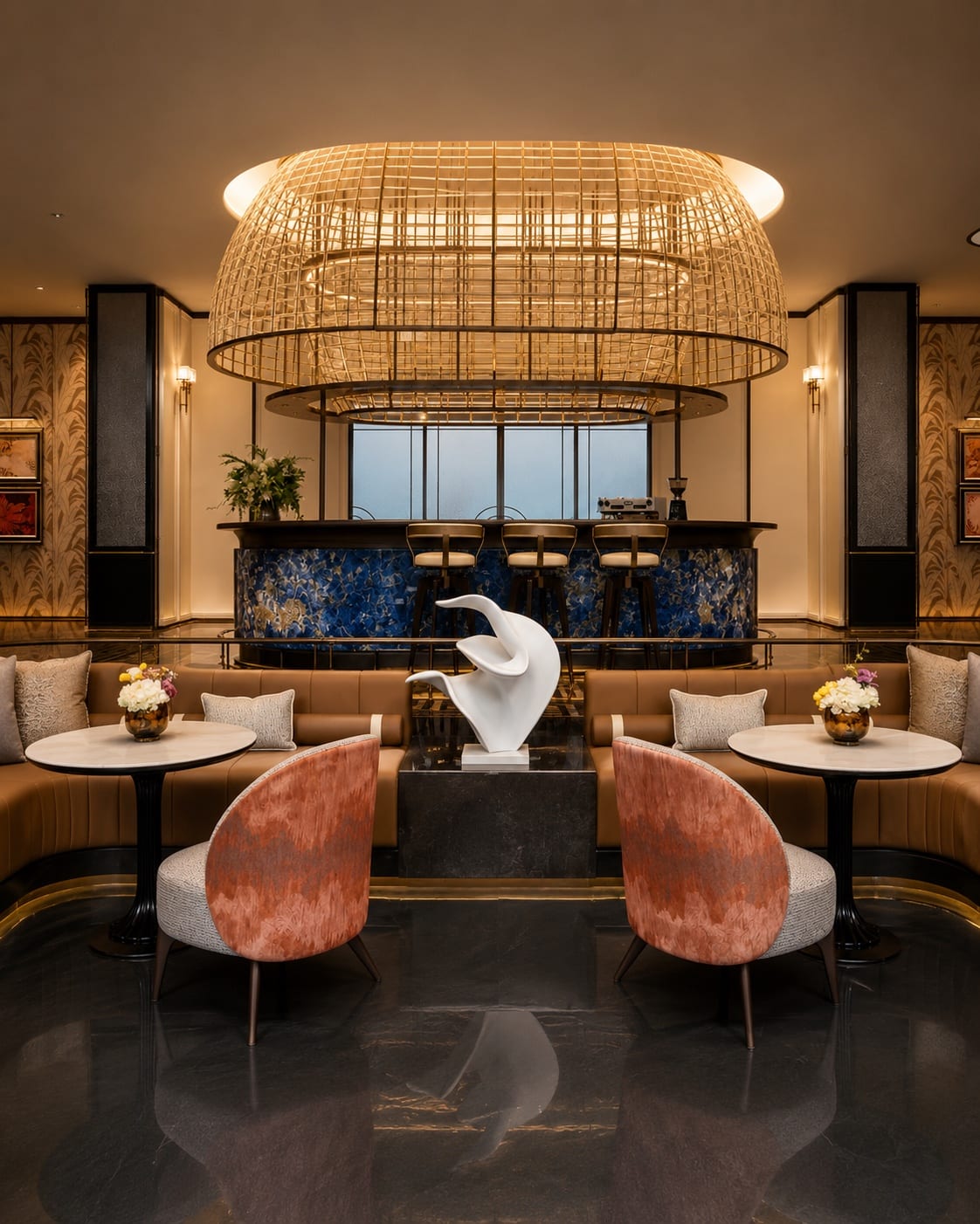 Large woven statement chandelier above a blue hospitality bar and white sculpture