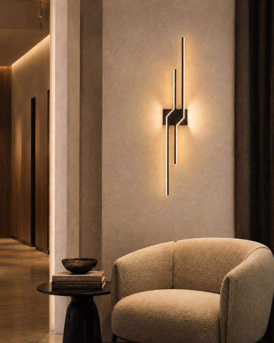 Geometric dark metal linear accent reading light with warm integrated illumination above a lounge chair