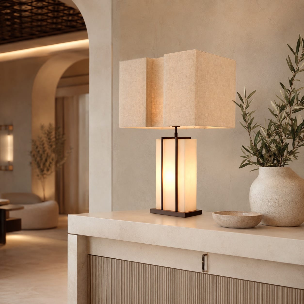 Custom table lamp with an illuminated translucent stone base and geometric linen shade