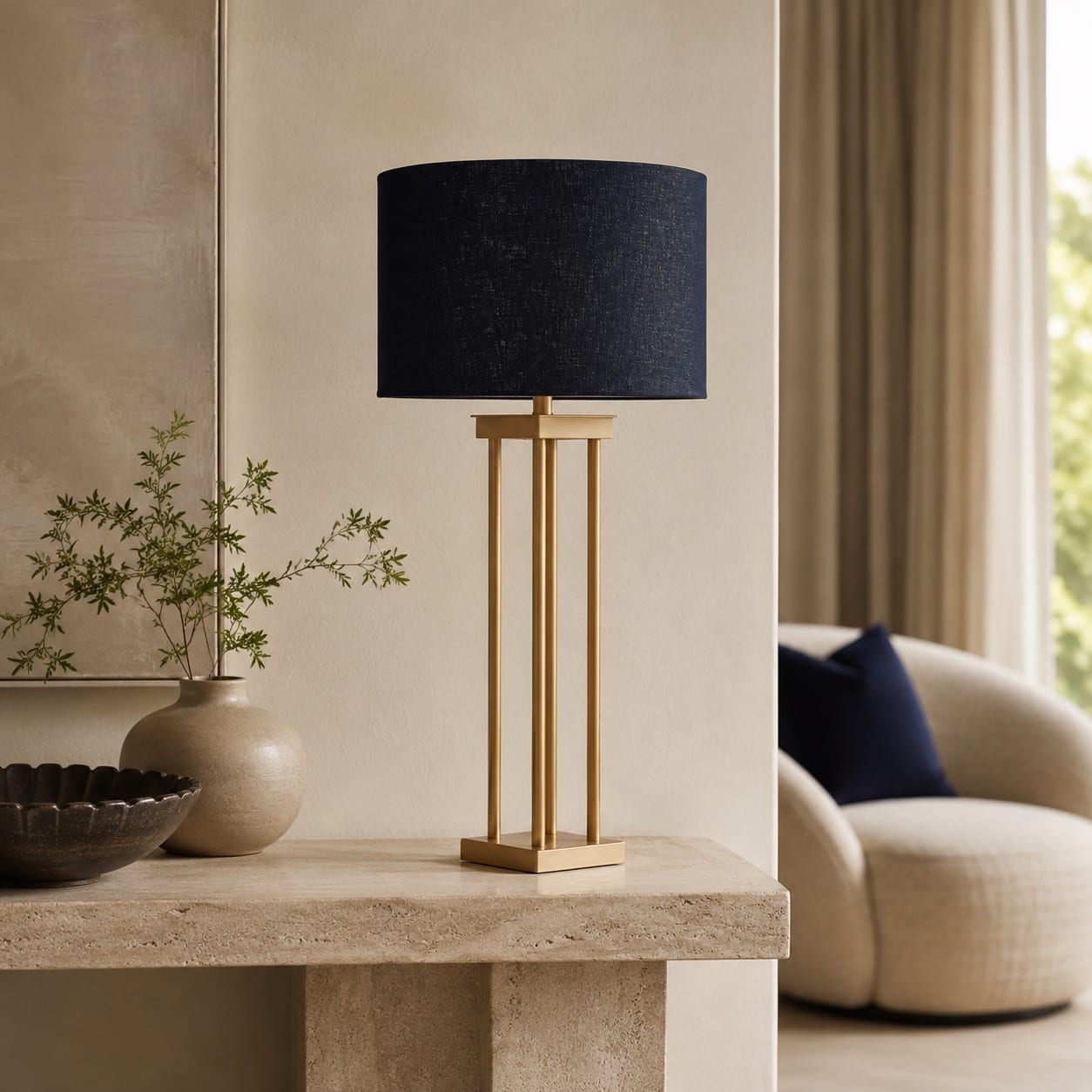 Custom slim brass-frame table lamp with a dark navy cylindrical fabric shade
