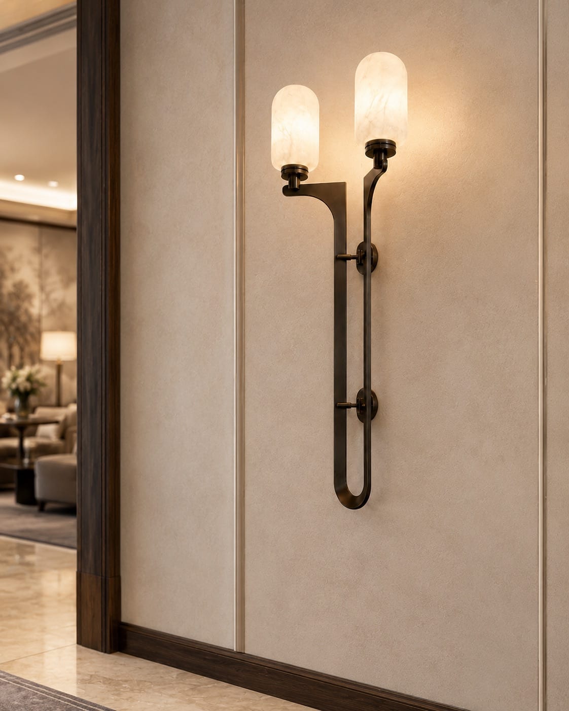 Double alabaster wall light with dark bronze metalwork in a luxury interior